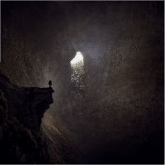 Man alone in a cave