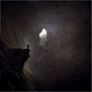 Man alone in a cave